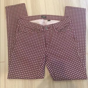 J. Crew red and white printed skinny jeans.