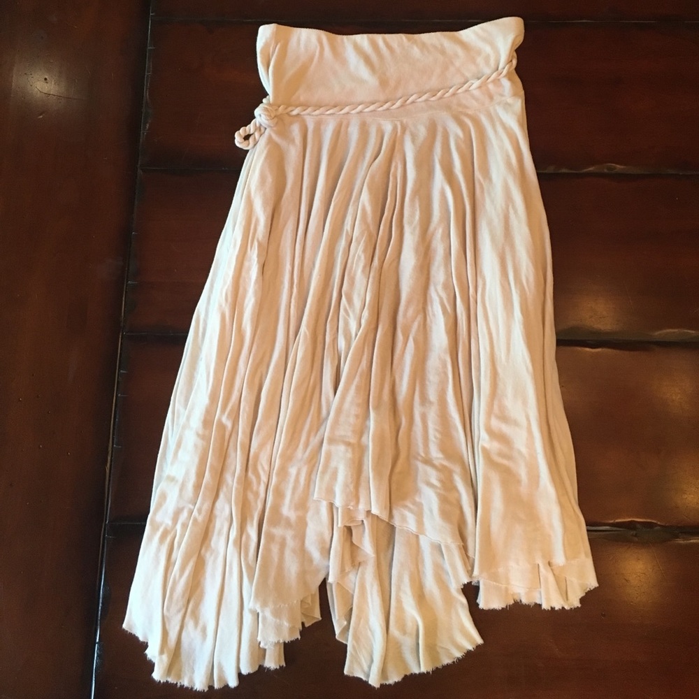 Off white, flowy skirt with attached rope belt.