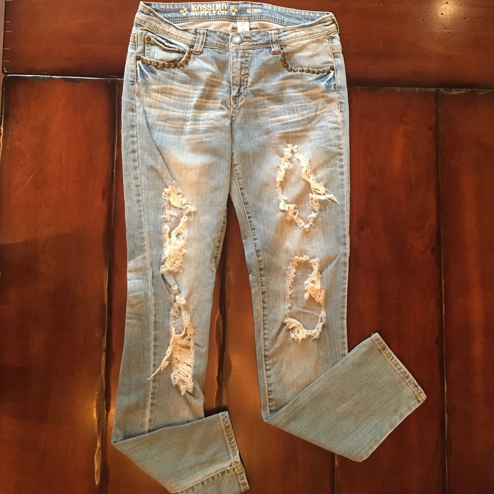 Light washed, ripped jeans with stud accents
