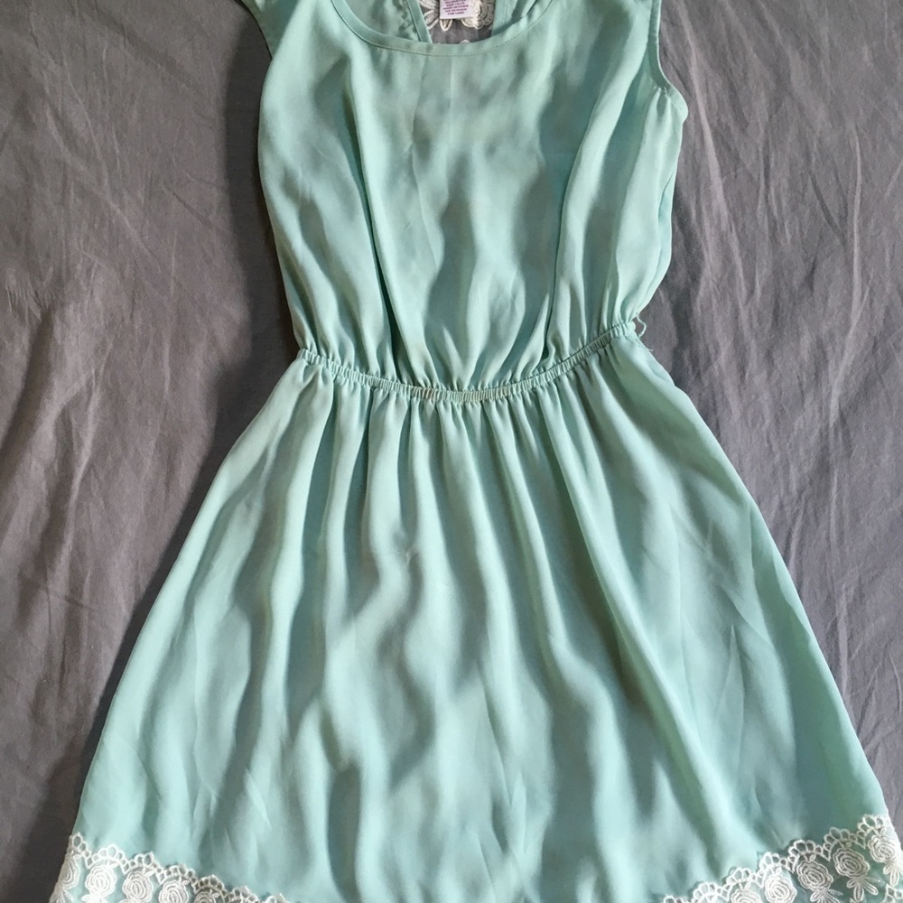 Mint colored dress with white lace detailing
