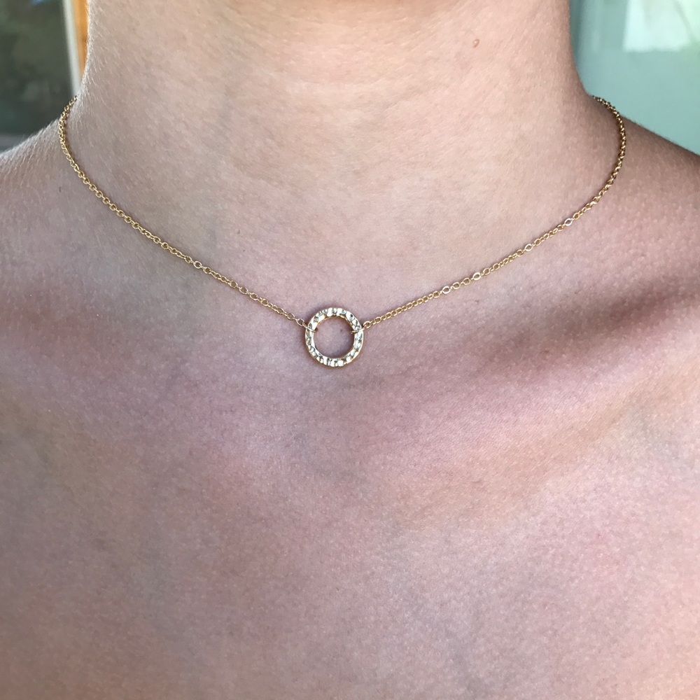 Dainty gold circle necklace.