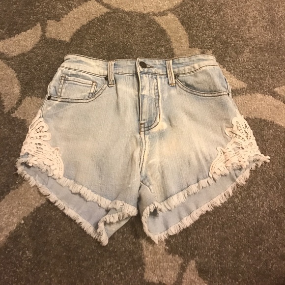 Super cute light blue jeans with patterns on side! - Picture 1 of 2