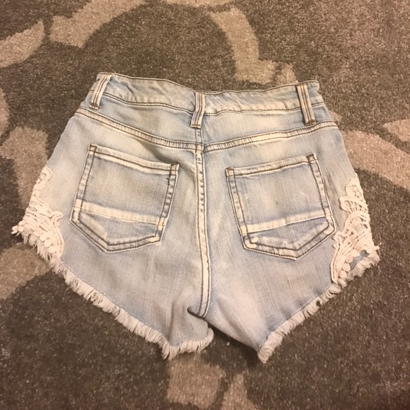 Super cute light blue jeans with patterns on side! - Picture 2 of 2