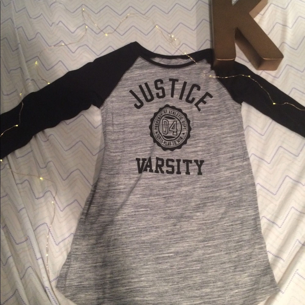 This is a gray and black quarter sleeve shirt.