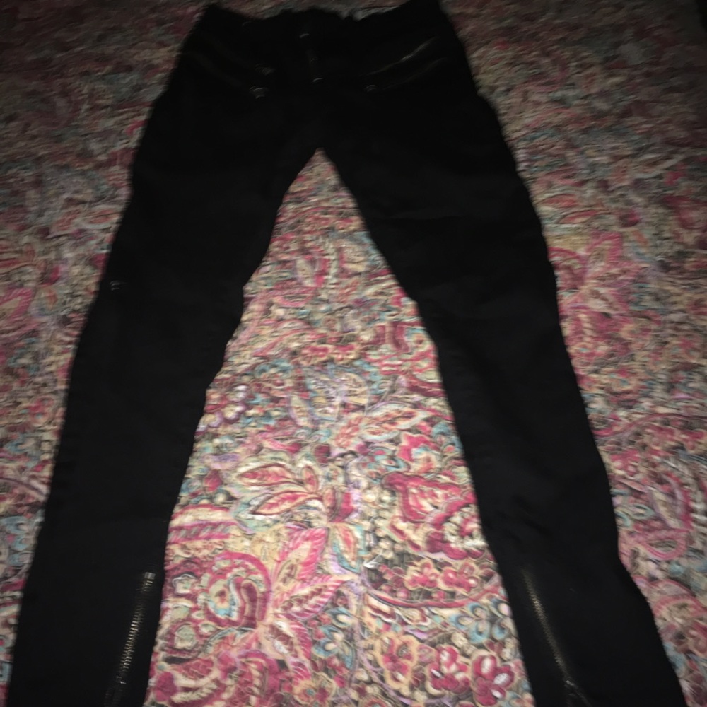 Long black jeans With slippers on the bottom