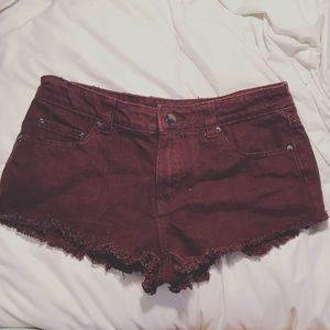 Maroon distressed shorts