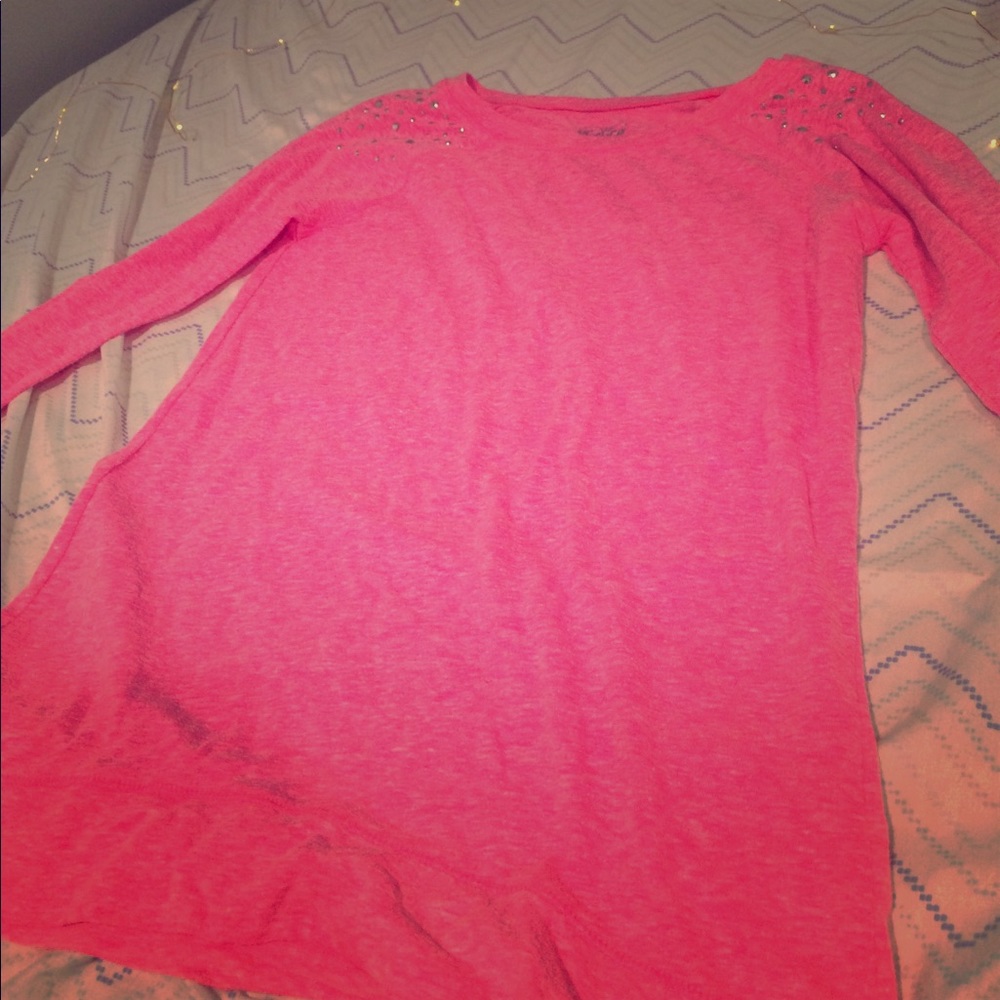 This is a long sleeve plain shirt with sparkles.