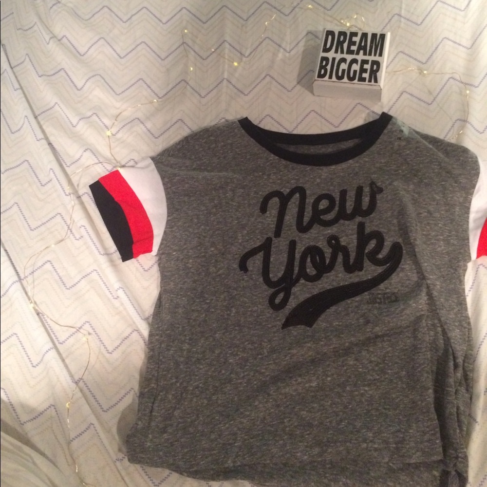 This is a gray top with New York sequined onto it.
