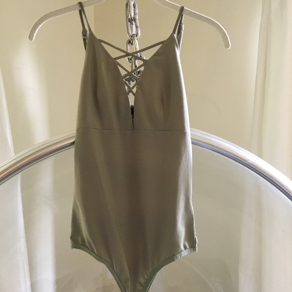 Dance & Marvell green body suit