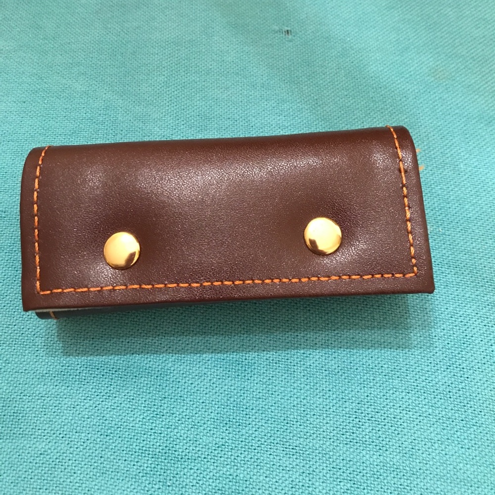 Hard leather key or coin holder