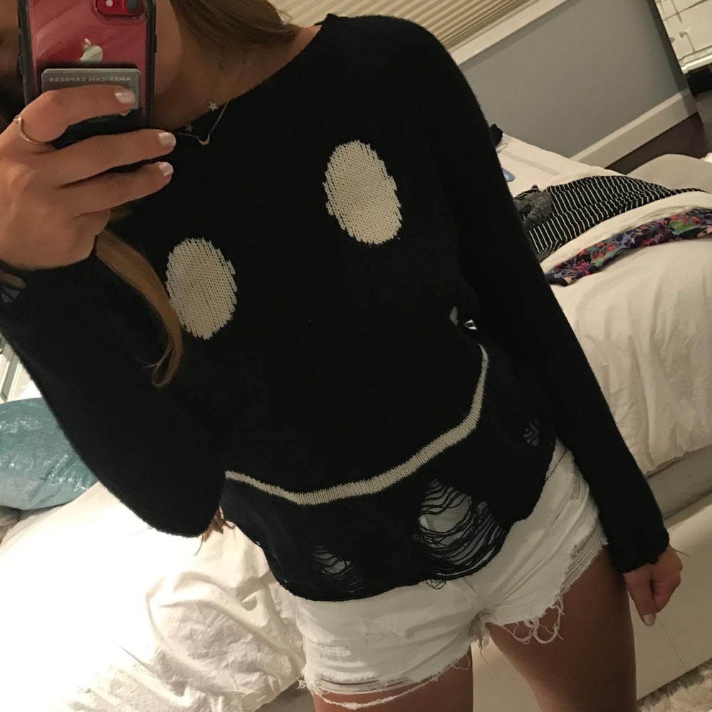 Cute smiley face sweater with rips
