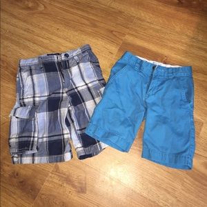 2 pairs of shorts, one plaid and one chino.