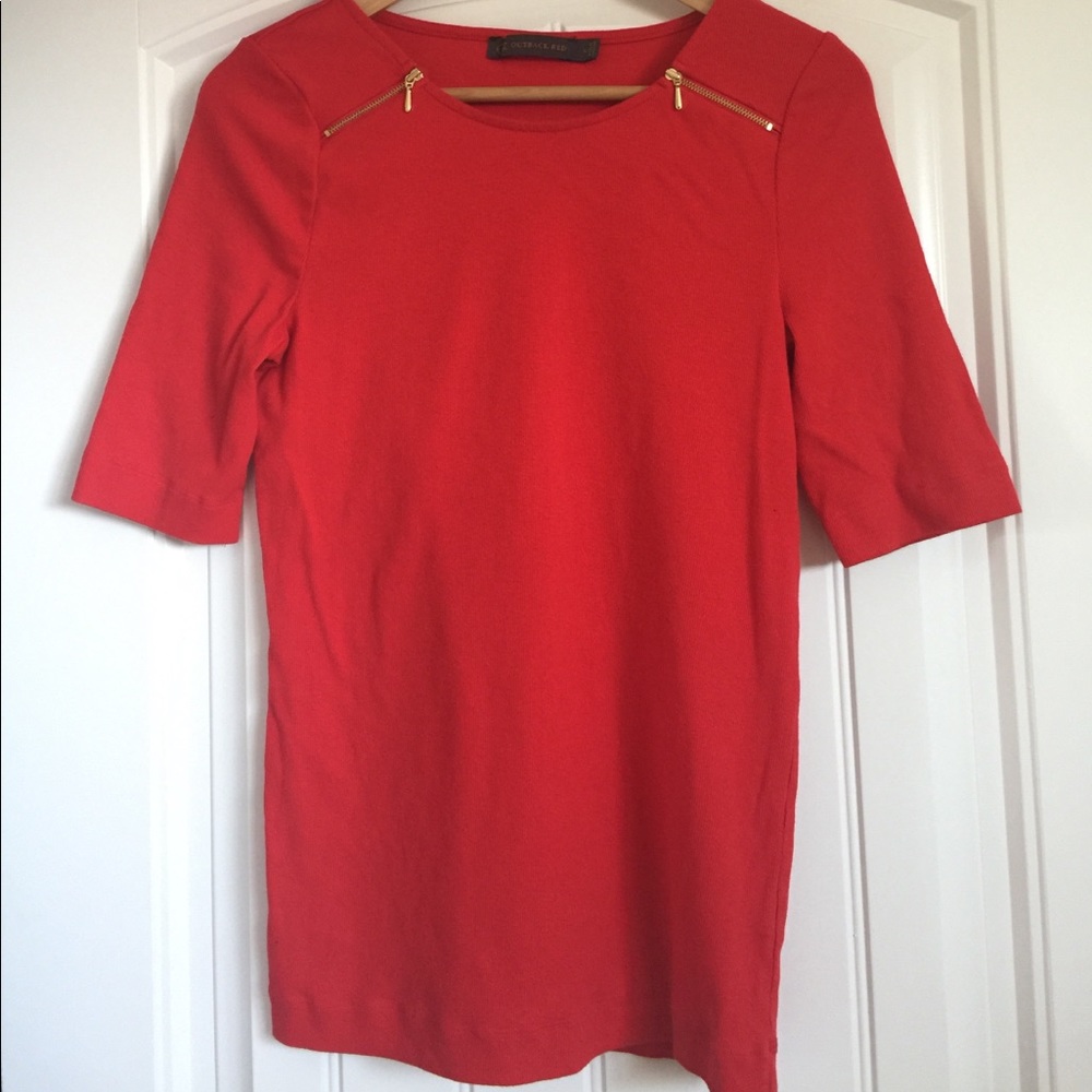 Red top with gold zipper accents