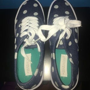 Polka dot tennis shoes.