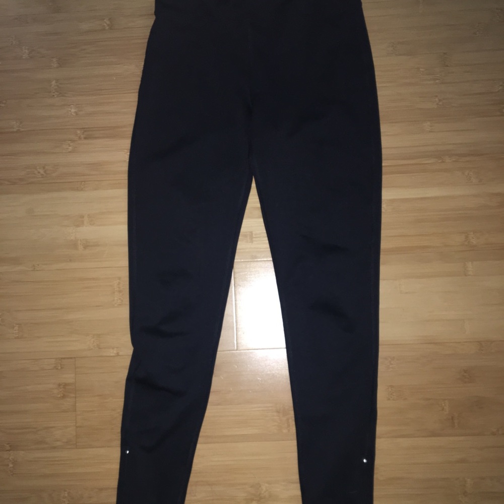 Black pants with zippers on the bottom
