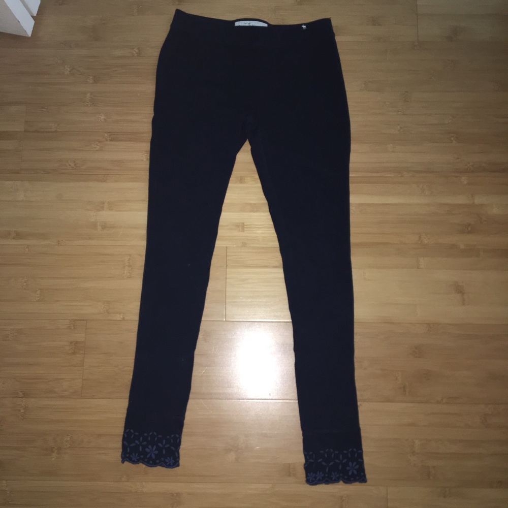Navy pants with detailing on the bottom