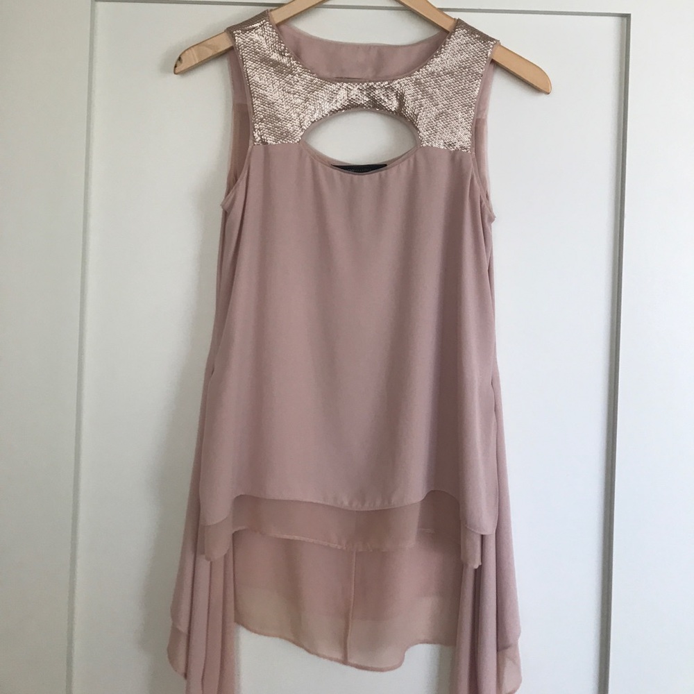 Sleek high low circle cut out sequence top