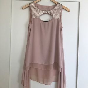 Sleek high low circle cut out sequence top