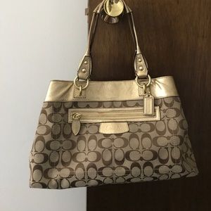 Gold and tan Coach purse