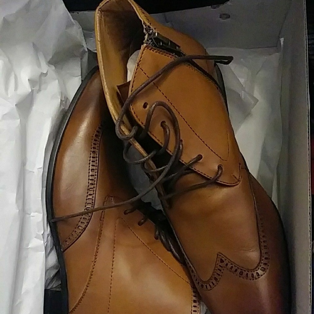 Ankle high tan leather boots.