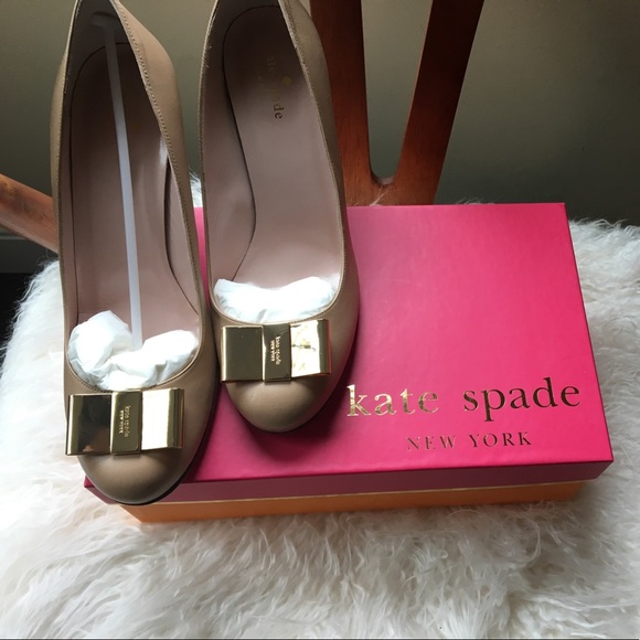 kate spade Shoes - Kate Spade NY tan leather wedge with gold bow