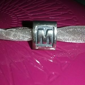 PANDORA letter M