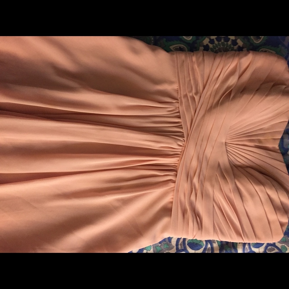 Ballet pink, strapless bridesmaid dress.