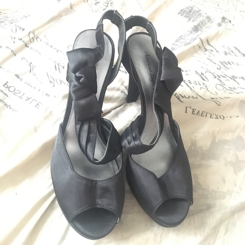 Black Strap Heels with a cute bow on the side!