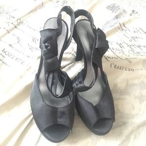 Black Strap Heels with a cute bow on the side!