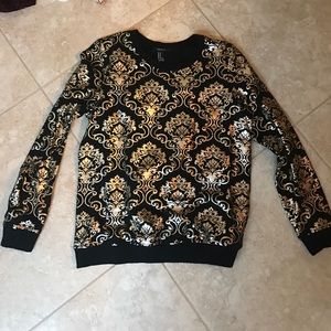 Very beautiful black sweater with silver design
