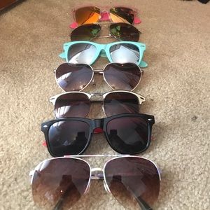 7 pairs of a variety of shaped sunglasses