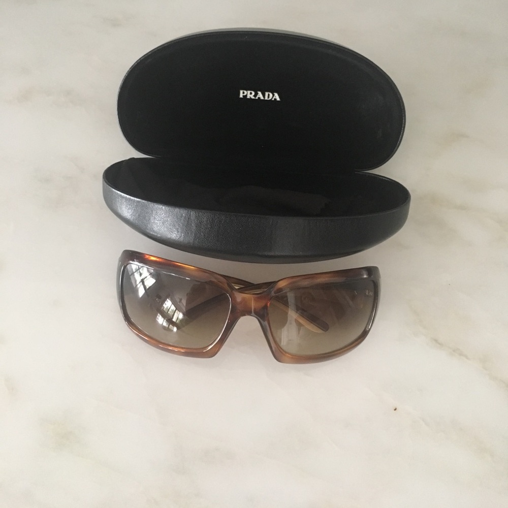 Brown tortoise wrap around Prada sunglasses