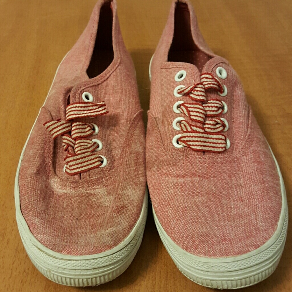 Red sneakers with striped laces