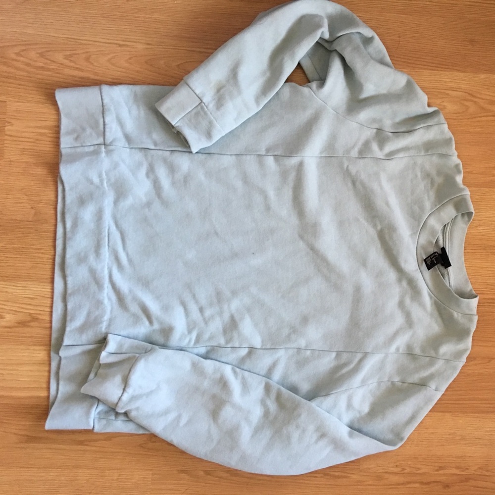 Light teal H&M crew neck with multiple hems