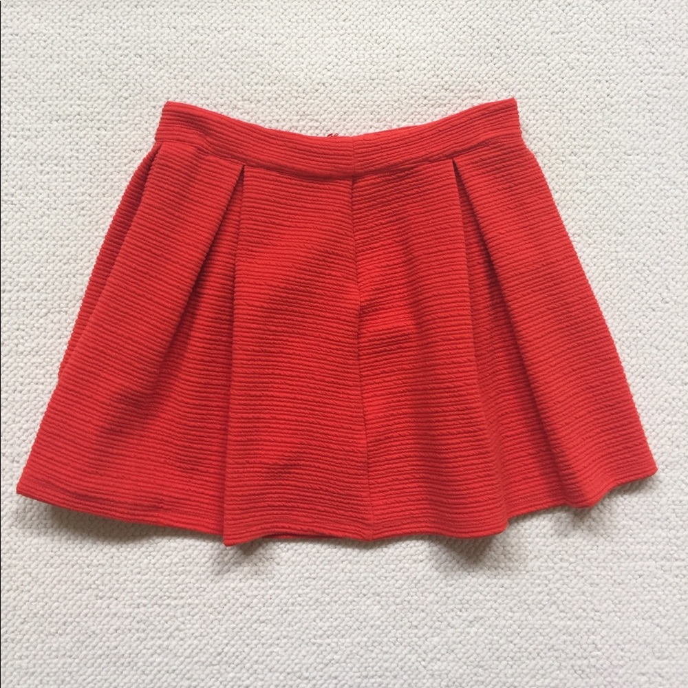 Red pleated skirt