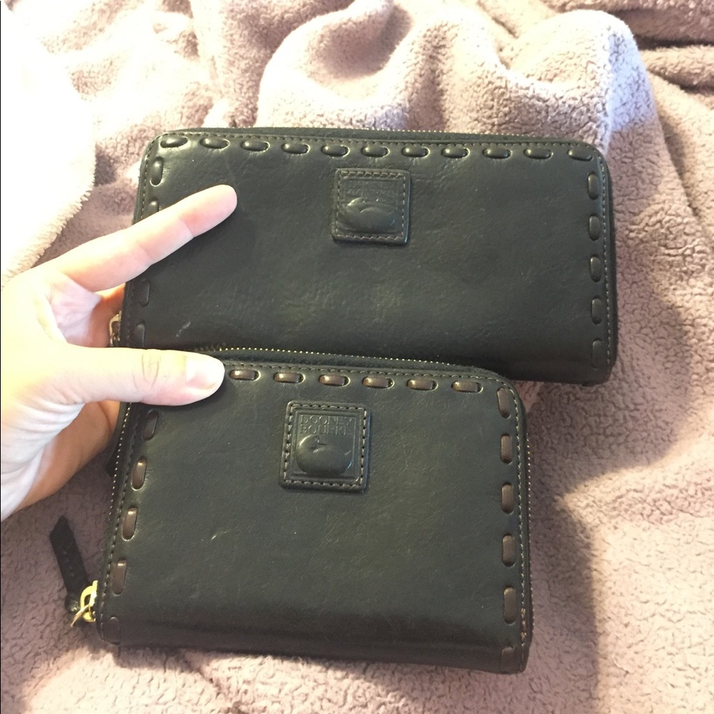 Two used Dooney & Bourke black Florentine wallets