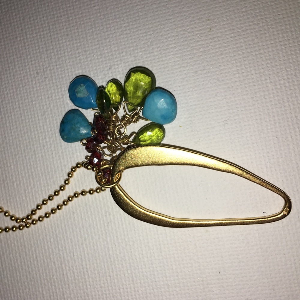 Beautiful gold necklace with sparks of color