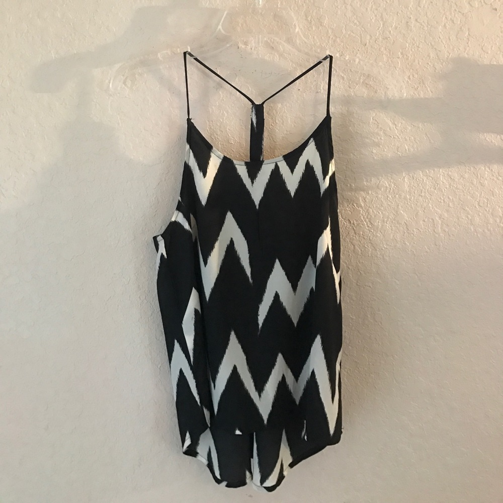 Loose fitting black and white tank top.