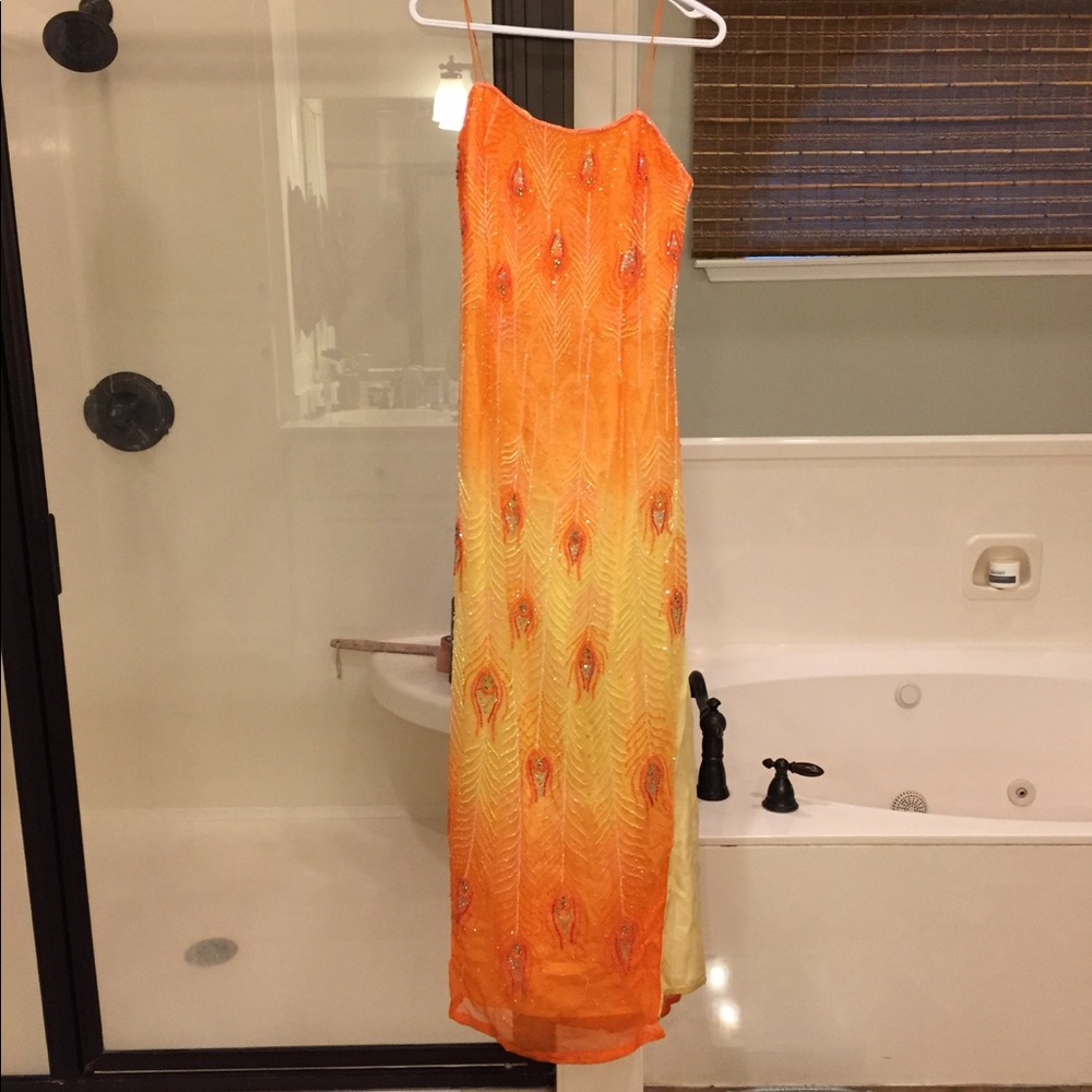 Orange/Yellow Peacock formal by Alyce