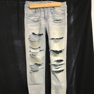 Distressed light denim pants