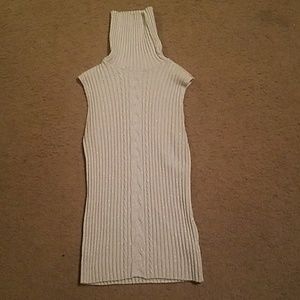Turtleneck sleeveless sweater.
