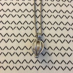 Caged pearl necklace