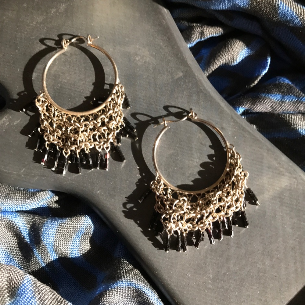 Gold tone earrings with black beads