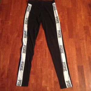 Pink Victoria secret leggings with logo up legs