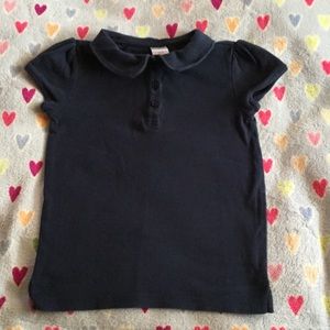 Girl's school uniform short sleeve polo.