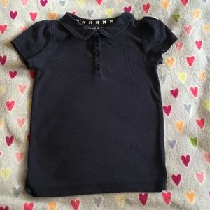 Girl's school uniform short sleeve polo.