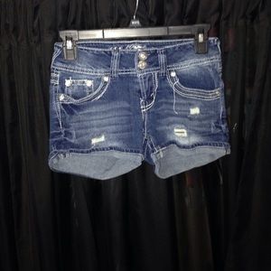 High wasted jean shorts, bejeweled bum.