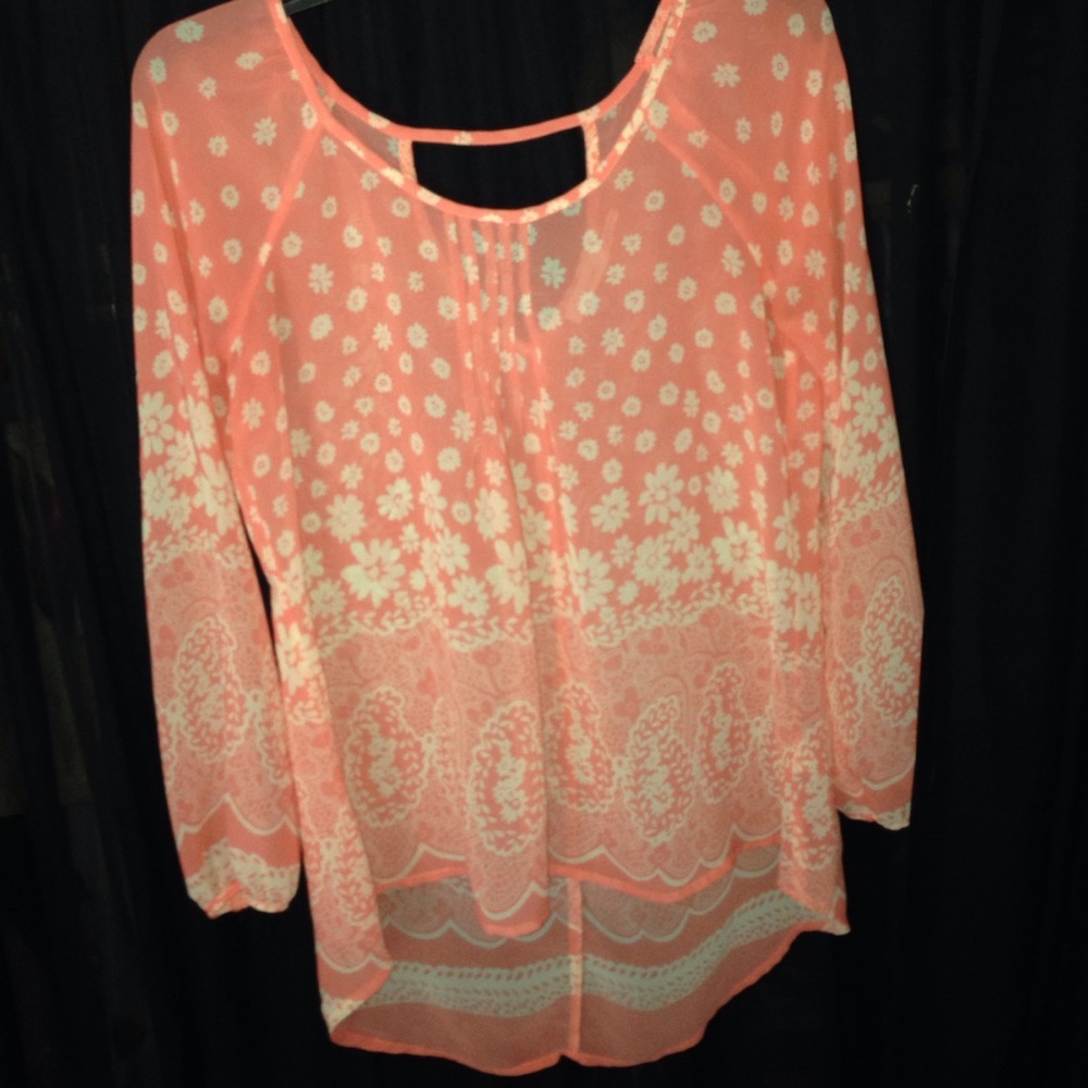 Peach blouse with white flower pattern