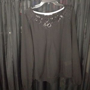 Black blouse with sparkly lace neckline.