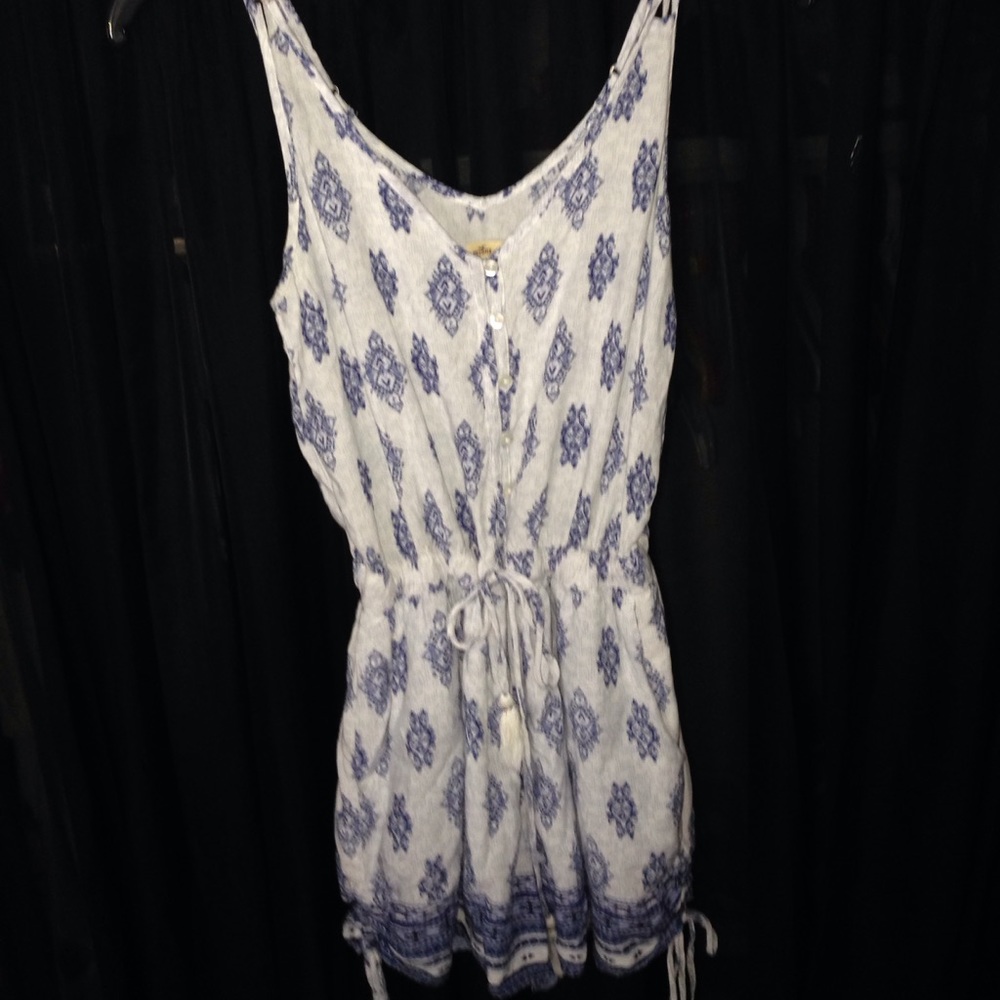 Blue/White romper w/ diamond shape pattern.